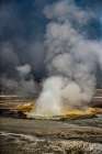 Geysers spew boiling water and steam into the air. Art Print